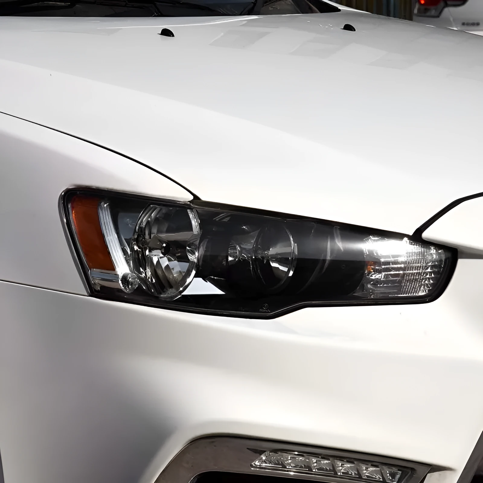 Transparent plastic car headlight housing cover showing 50mm by 30mm dimensions