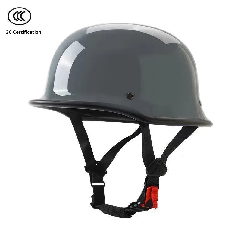Men's retro motorcycle helmet in matte black ABS construction, side view on white background