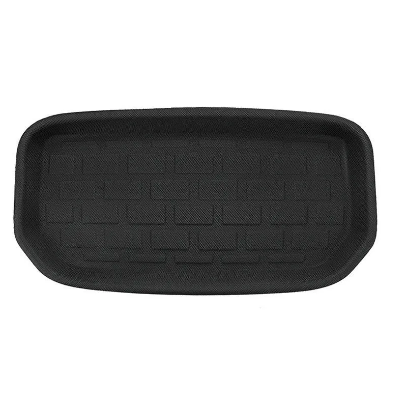 Custom TPR floor mat set for Tesla Model Y showing footwell, storage box, and tailbox mats.