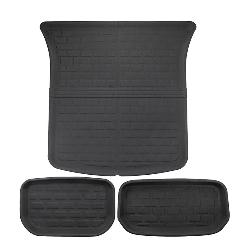 Custom TPR floor mat set for Tesla Model Y showing footwell, storage box, and tailbox mats.