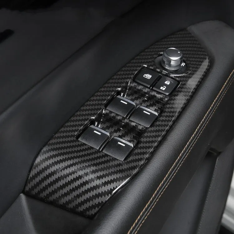 Pair of left and right ABS steering wheel frame trims with carbon fibre pattern for adhesive installation.