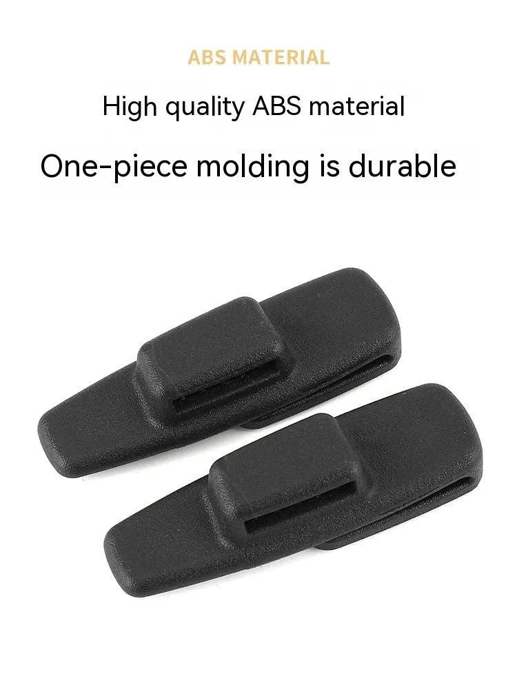 Two black ABS plastic car seatbelt stopper clips for adjusting length and preventing neck pinch.