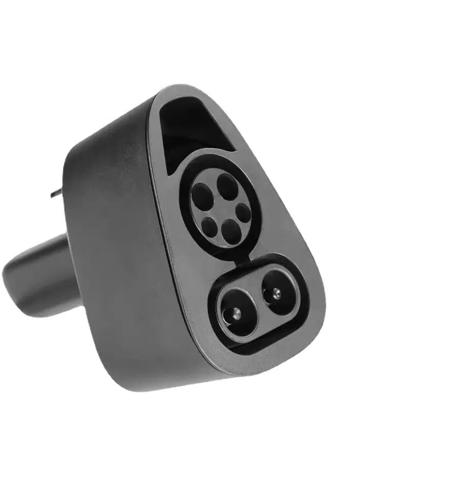 Black Tesla charging plug conversion adapter with dimensions 195mm by 96mm by 67mm