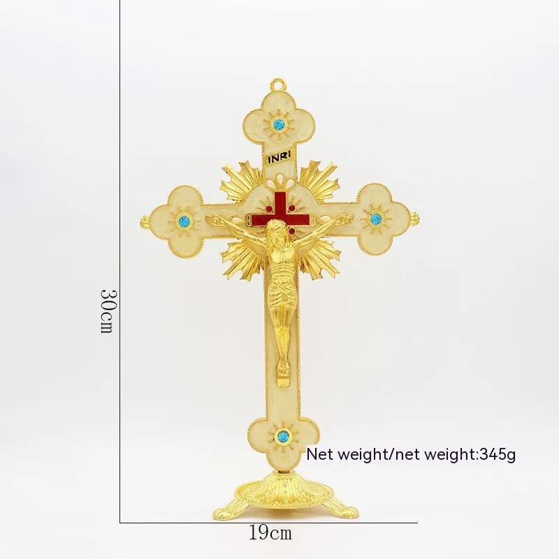 Gold geometric zinc alloy car ornament with micro-inlaid design on a desktop.
