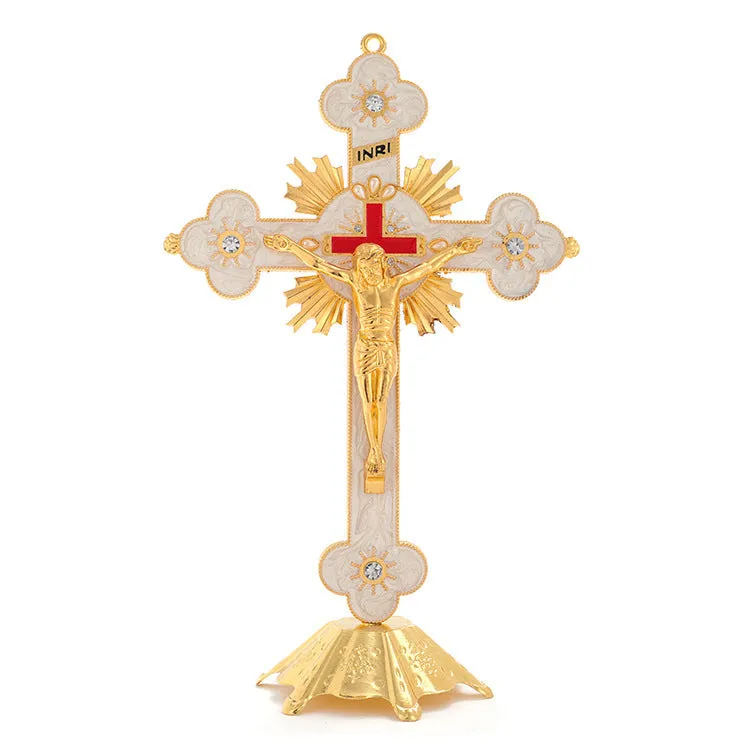 Gold geometric zinc alloy car ornament with micro-inlaid design on a desktop.