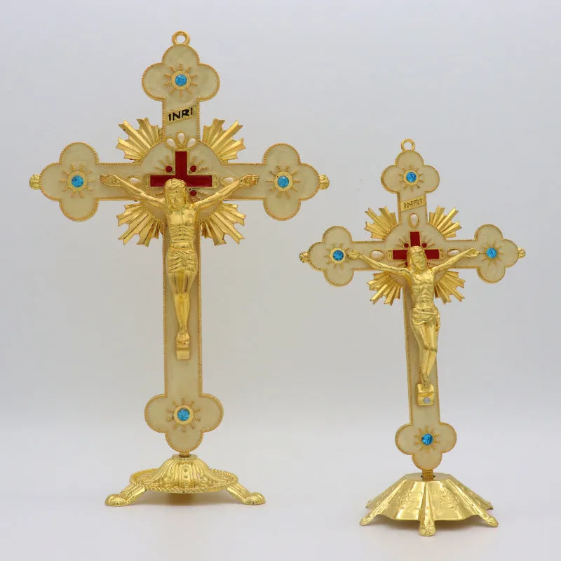 Gold geometric zinc alloy car ornament with micro-inlaid design on a desktop.