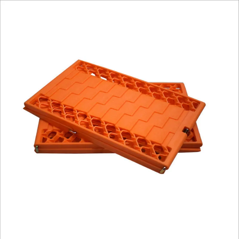 Orange folding vehicle rescue board showing rubber grip surface and folded size