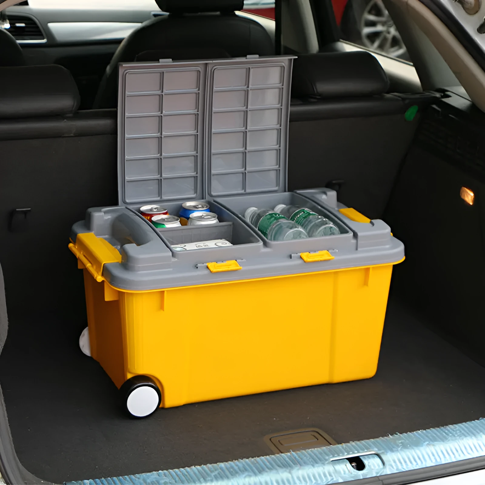 Large orange plastic storage box with pull-out handle and wheels, showing 55L capacity and double-seal lid.