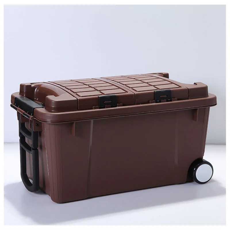 Large orange plastic storage box with pull-out handle and wheels, showing 55L capacity and double-seal lid.