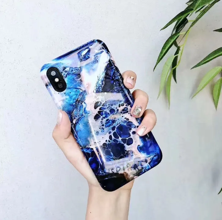 Colourful stone pattern soft protective case for iPhone on a table.
