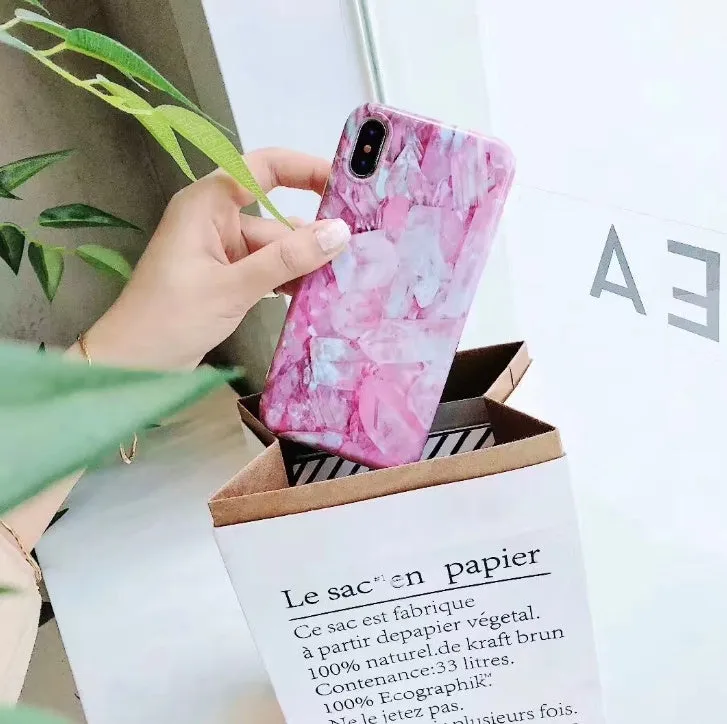 Colourful stone pattern soft protective case for iPhone on a table.