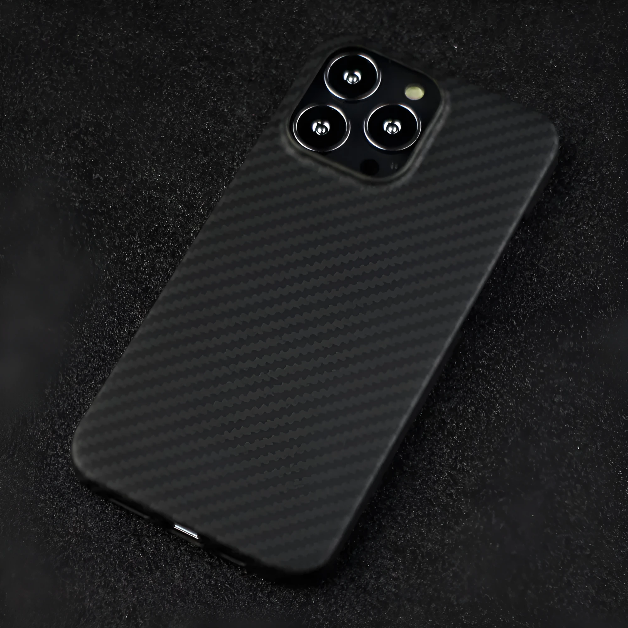 Matte black Kevlar fibre protective case for iPhone showing stripe detail and precise model fit