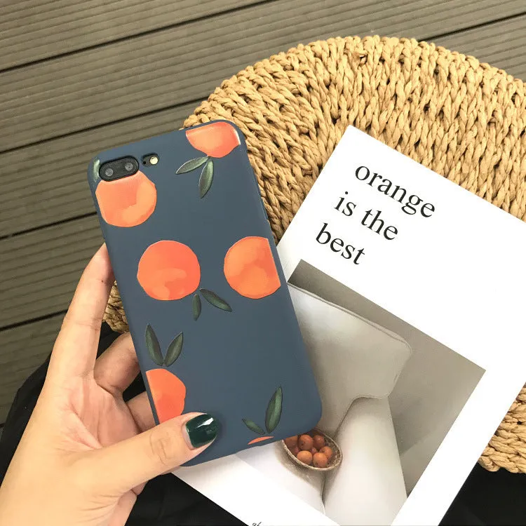 Orange matte finish TPU silicone case for iPhone on a table.