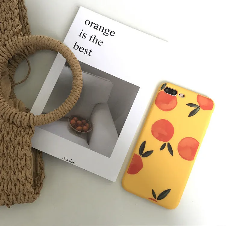 Orange matte finish TPU silicone case for iPhone on a table.