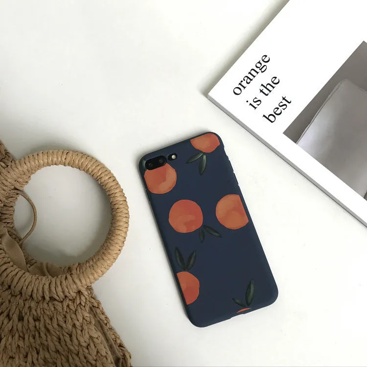 Orange matte finish TPU silicone case for iPhone on a table.