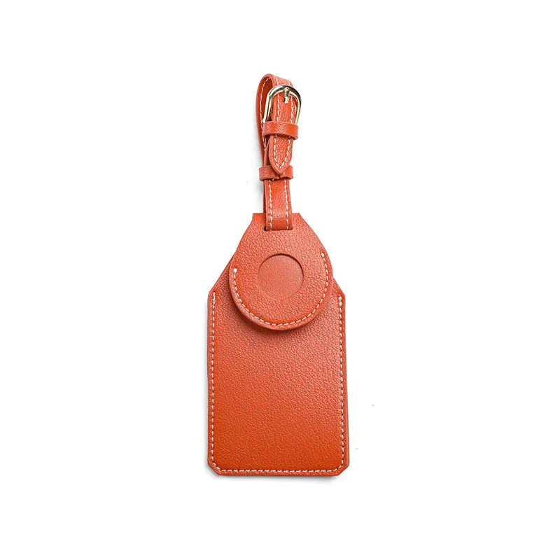 Black, brown, and orange PU/PVC protective cases for a luggage tag location tracker.