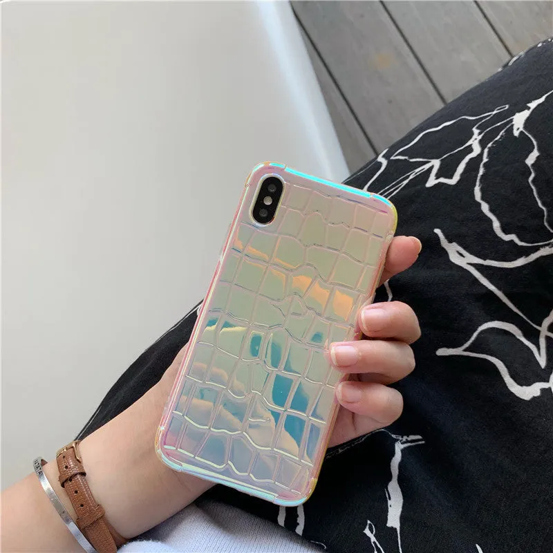 Glossy silver silicone phone case with a laser-etched irregular texture for iPhone, showing raised camera protection.