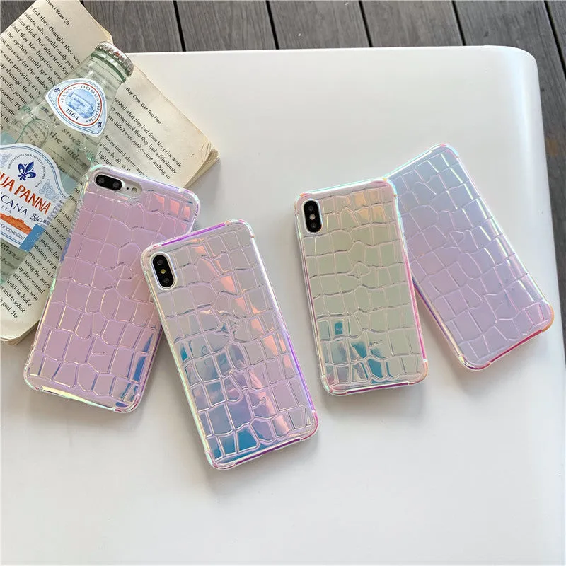 Glossy silver silicone phone case with a laser-etched irregular texture for iPhone, showing raised camera protection.
