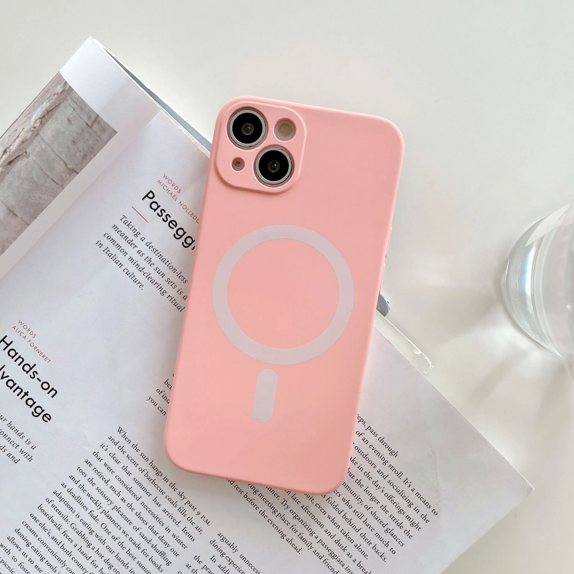 Magnetic wireless charging case for iPhone in various colours including blue, orange, and black.