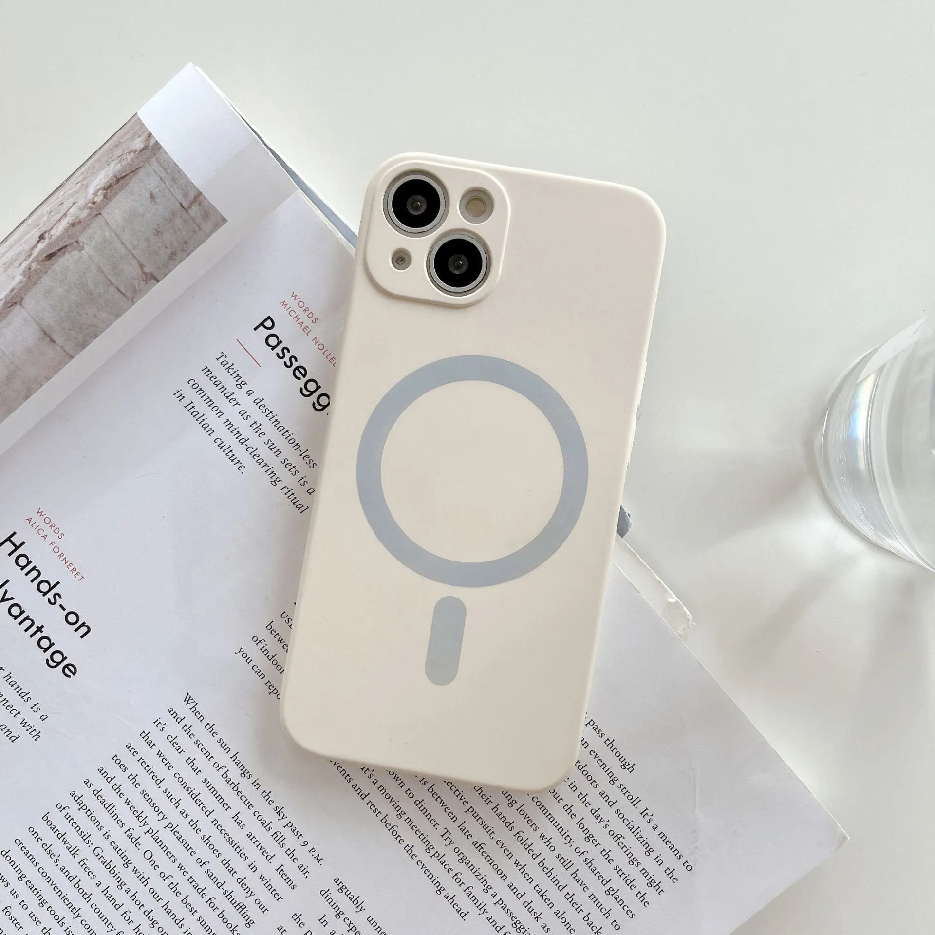 Magnetic wireless charging case for iPhone in various colours including blue, orange, and black.