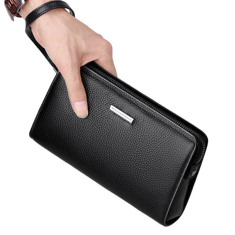 Men's black genuine leather clutch wallet open to show internal card slots, phone pocket, and zippered compartment.