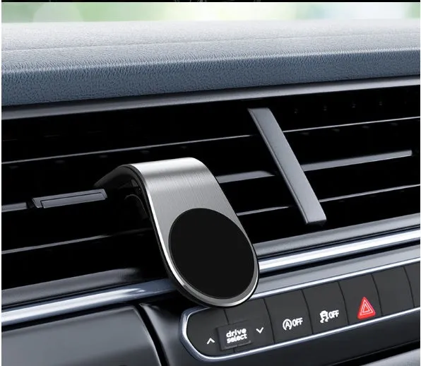 Black universal car phone holder bracket mounted on a car dashboard holding a smartphone.