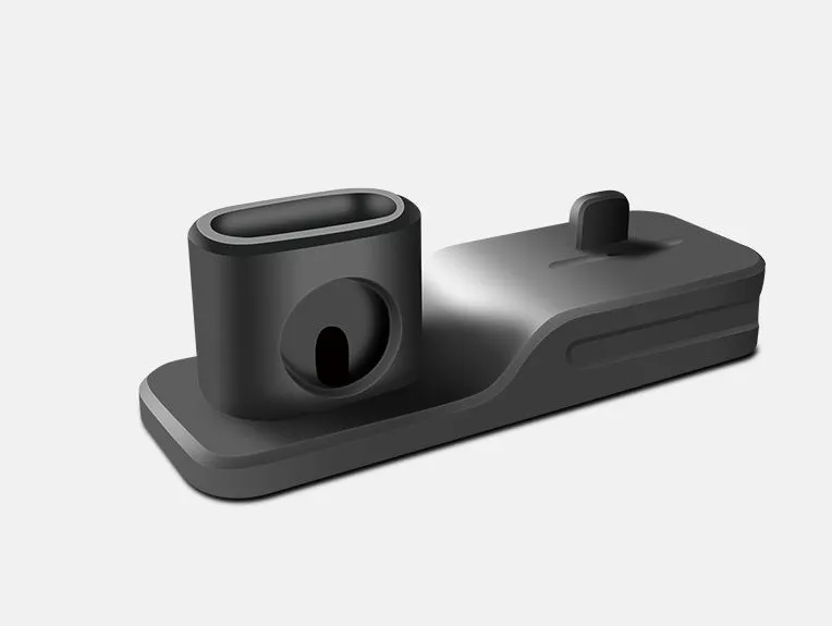Black silicone 3-in-1 charging base for Apple-compatible iPhone, iWatch and AirPods devices on flat surface