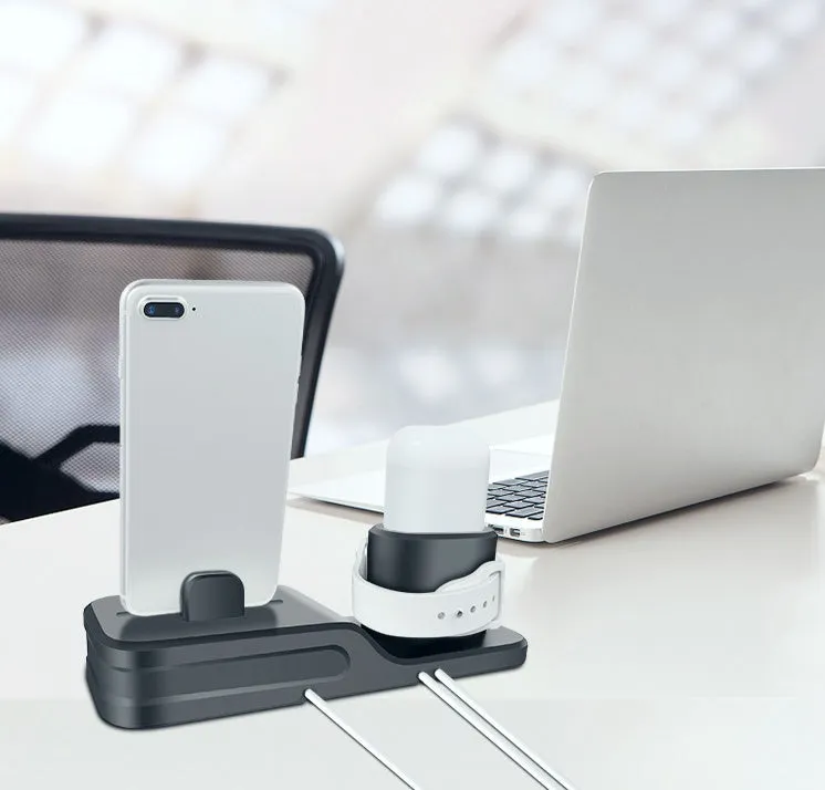 Black silicone 3-in-1 charging base for Apple-compatible iPhone, iWatch and AirPods devices on flat surface