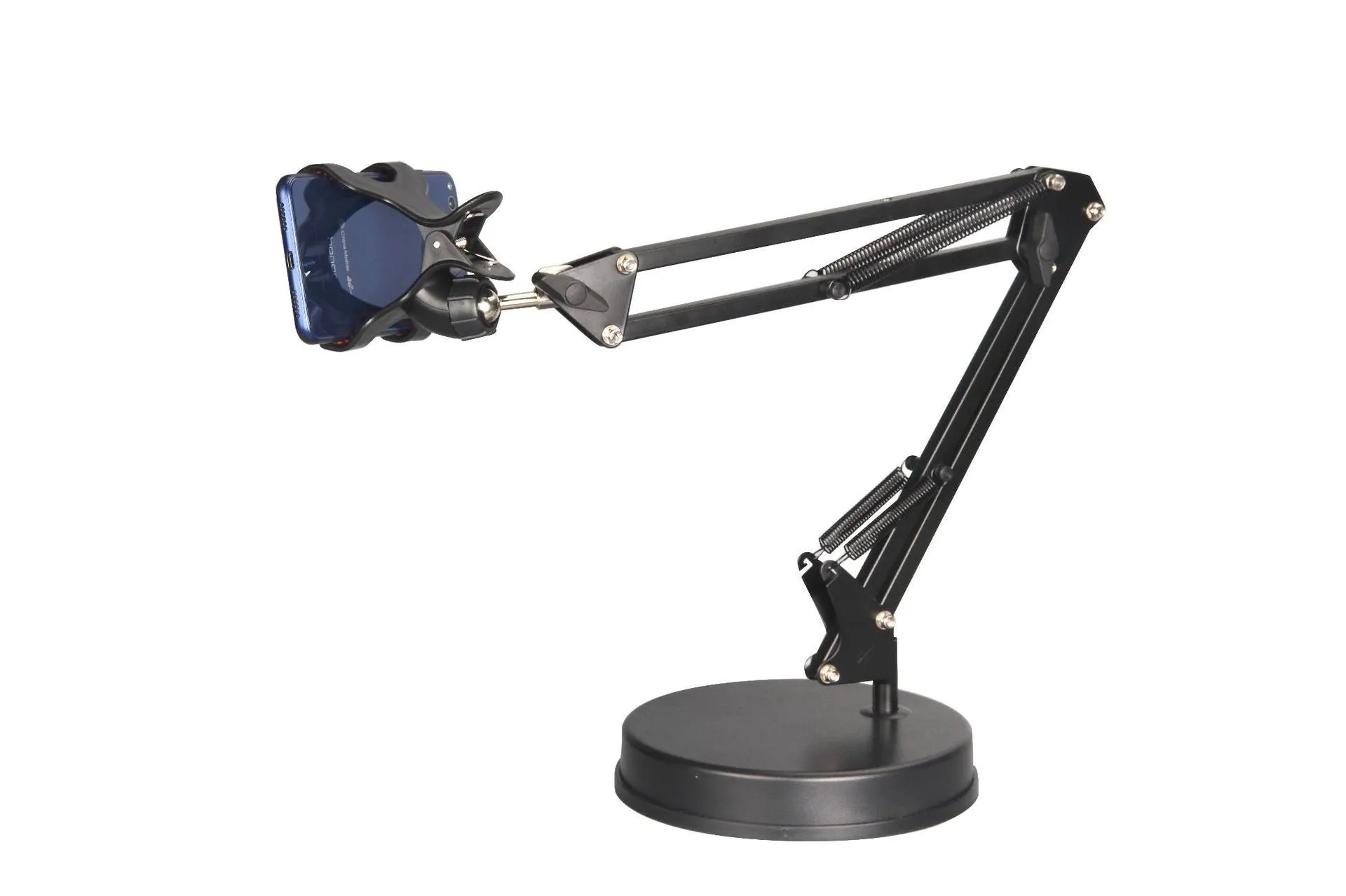 Black universal phone stand with long rotating metal arm and heavy circular base on a wooden desk.