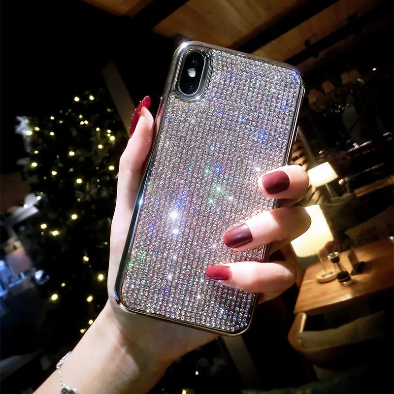 Silver silicone diamond-encrusted phone case for various iPhone models.