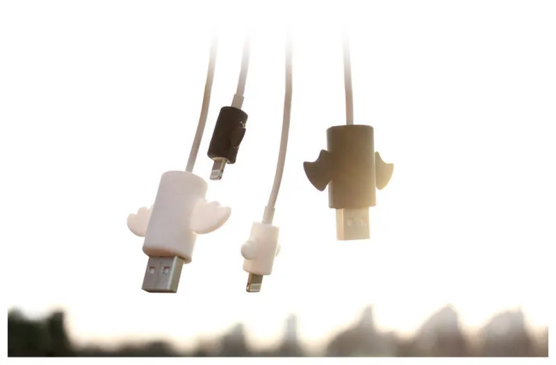 White Angel and black Bat design silicone protective covers for mobile phone charging cables in two sizes.