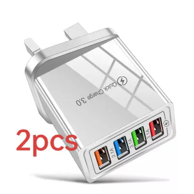 Four-port USB wall charger with UK three-pin plug in black and white colour scheme