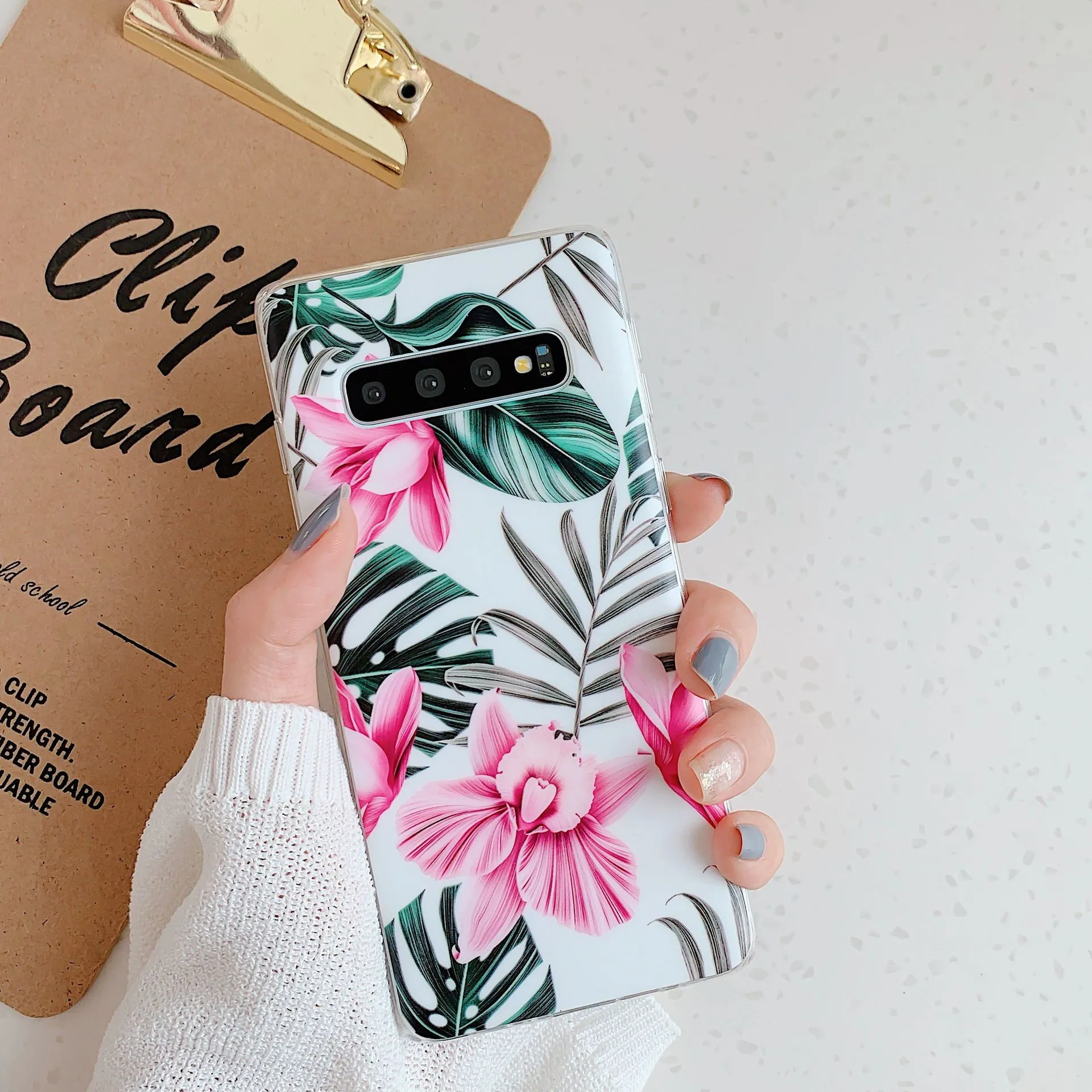 Samsung Galaxy phone case with green leaf flower design on TPU material.