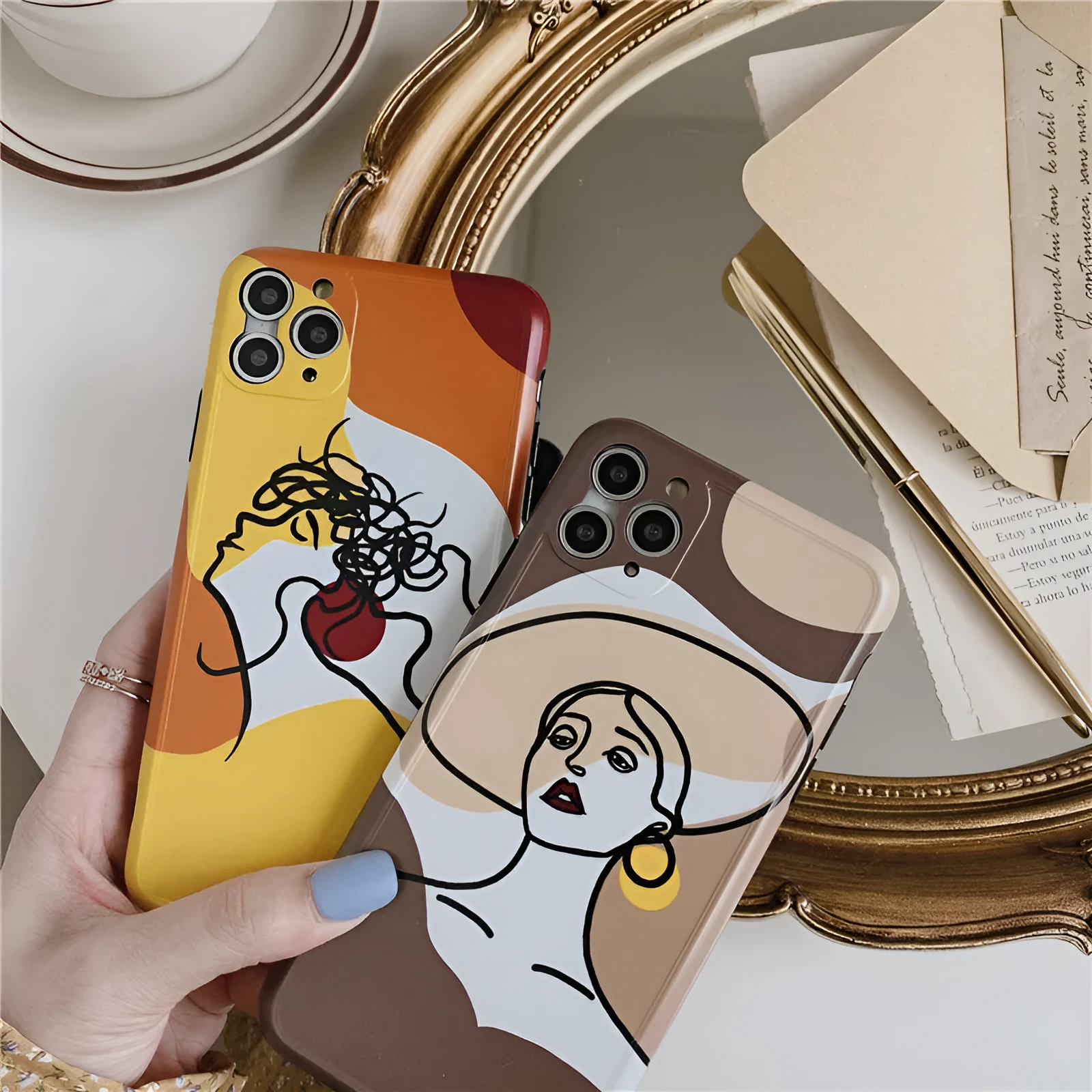 Orange yellow cartoon line art silicone protective case for iPhone on a phone.