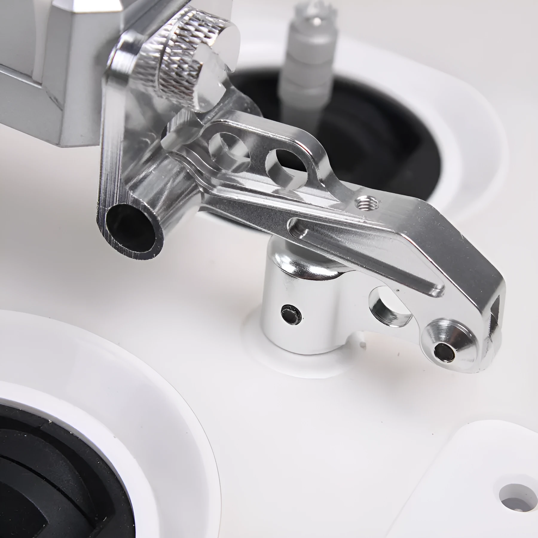 Silver metal universal phone holder with clip and lanyard for car model remote control accessories.