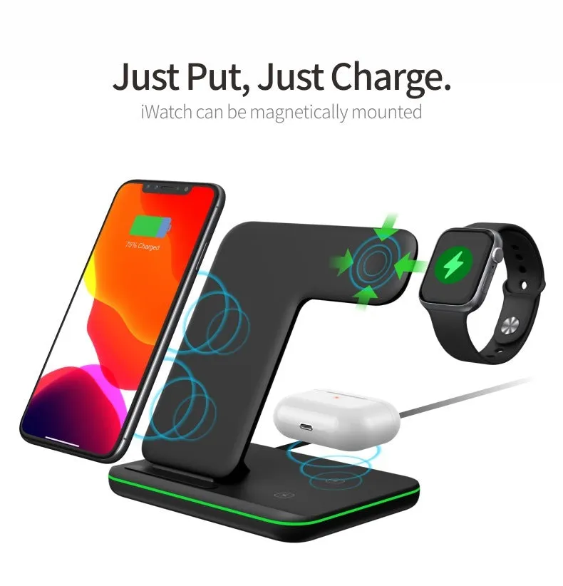 A white three-in-one wireless charging stand on a desk, charging a mobile phone, a smartwatch, and a pair of wireless headphones.