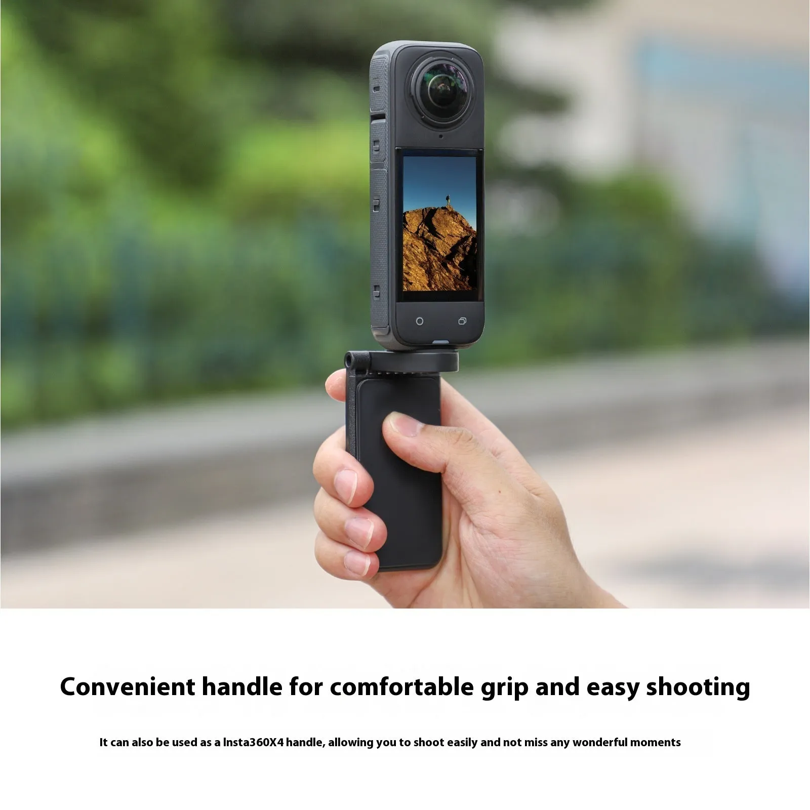 Black magnetic bracket base and handle accessory for Insta360 X4 camera on a desktop