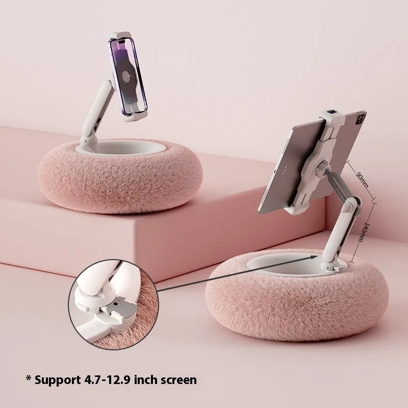 Adjustable rotating phone and tablet bracket on a desk, showing the clamp and fabric base.