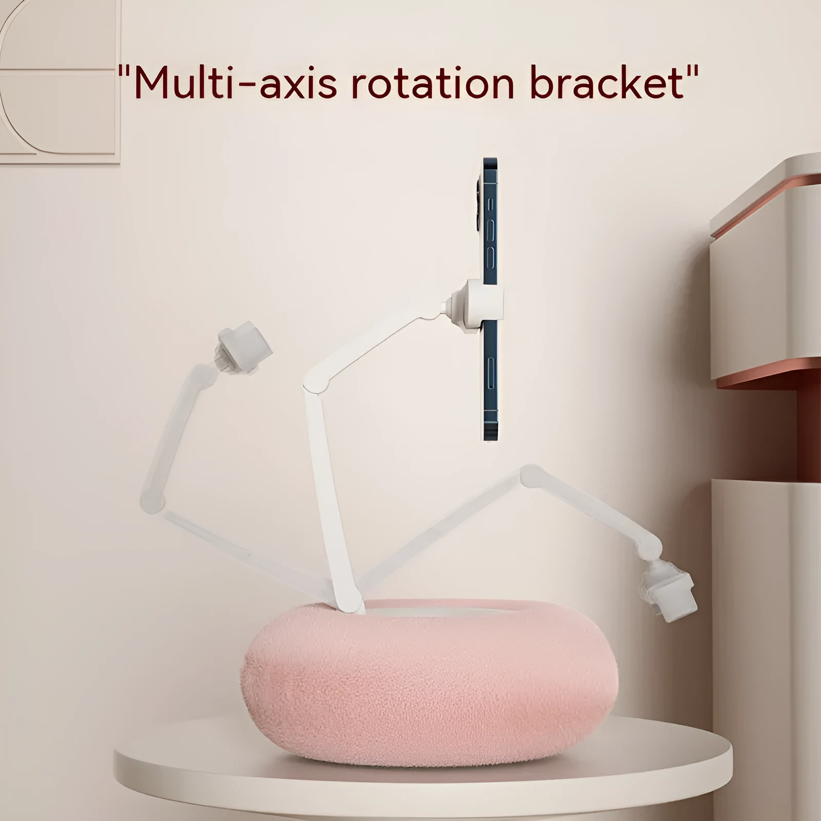 Adjustable rotating phone and tablet bracket on a desk, showing the clamp and fabric base.
