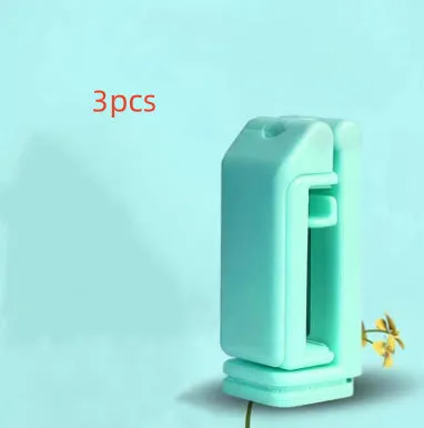 H22 Black colour 360-degree rotating collapsible mobile phone desktop holder on a wooden table.