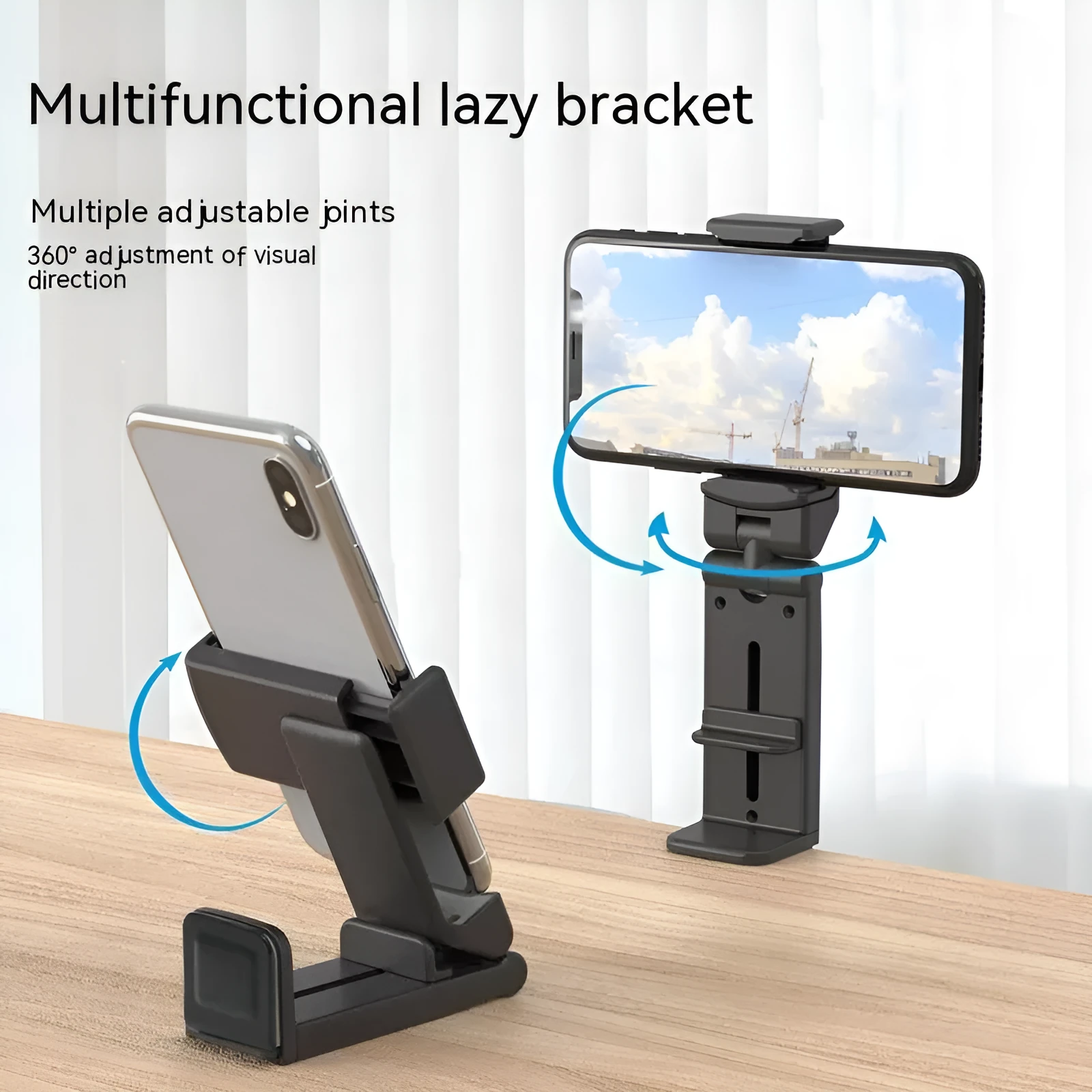 H22 Black colour 360-degree rotating collapsible mobile phone desktop holder on a wooden table.