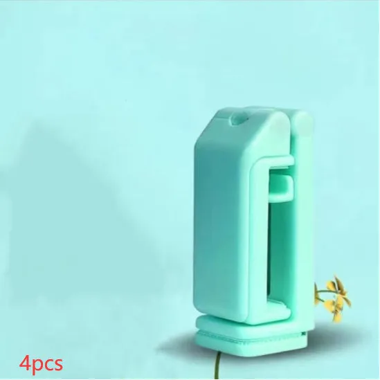 H22 Black colour 360-degree rotating collapsible mobile phone desktop holder on a wooden table.