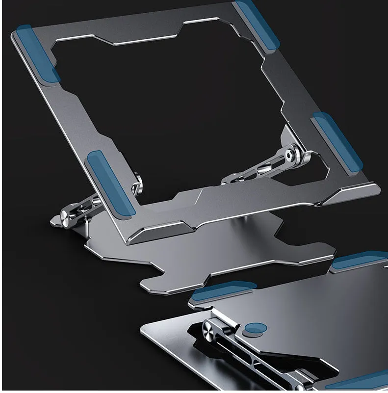 Grey aluminium laptop stand in a folded position next to an open laptop, showing its adjustable angle and hollow design.
