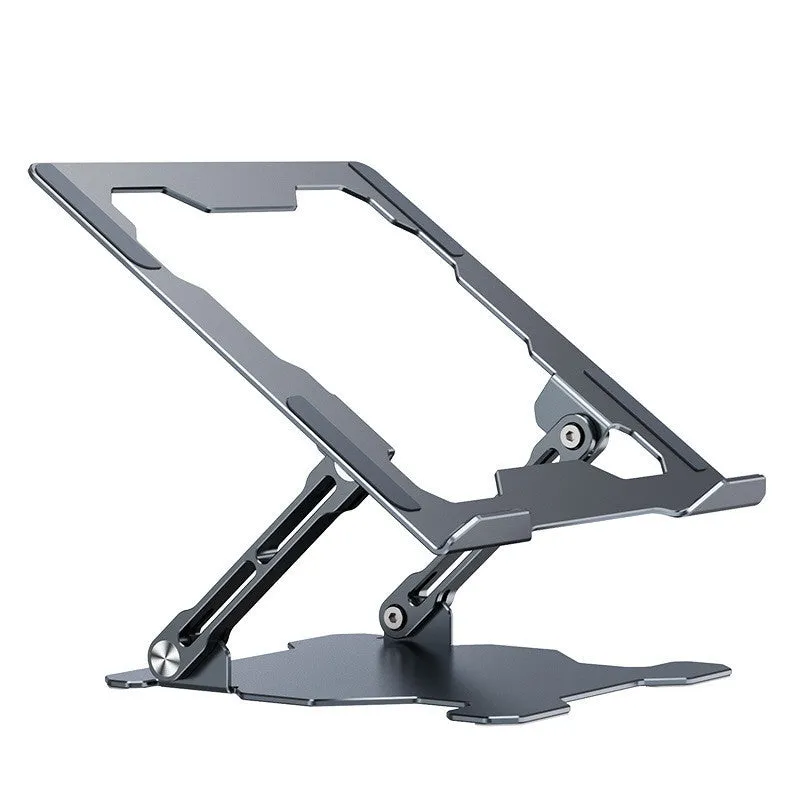 Grey aluminium laptop stand in a folded position next to an open laptop, showing its adjustable angle and hollow design.