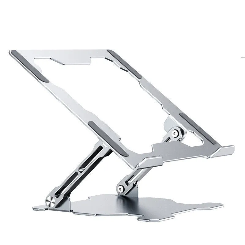 Grey aluminium laptop stand in a folded position next to an open laptop, showing its adjustable angle and hollow design.