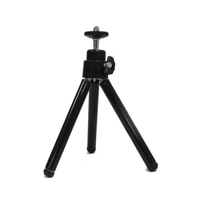 Mini flexible aluminium desktop tripod with ball head extended, alongside a universal U-shaped black phone clip.