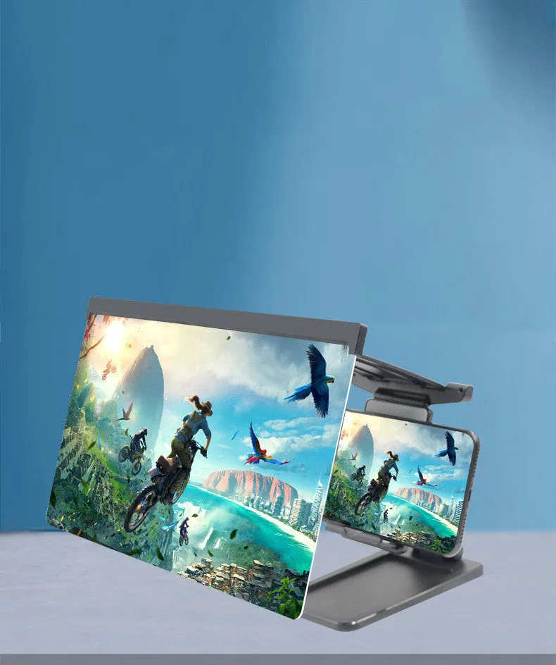 Black folding mobile phone screen amplifier with detached phone holder on a desk