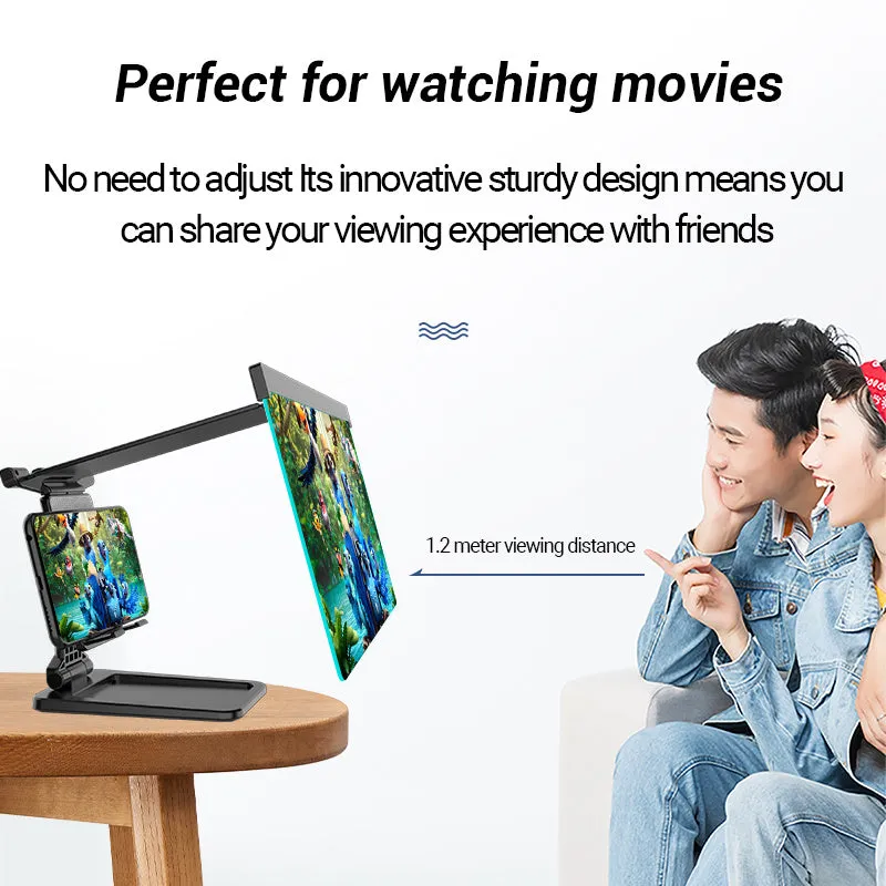 Black folding mobile phone screen amplifier with detached phone holder on a desk