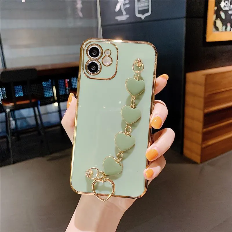 Green silicone mobile phone case with an attached white bracelet for a Samsung Galaxy model.