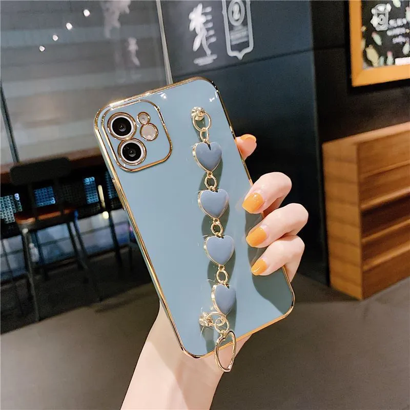 Green silicone mobile phone case with an attached white bracelet for a Samsung Galaxy model.
